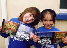 Students holding CDs